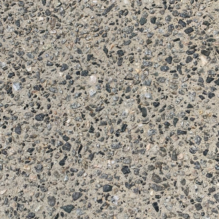Close up of exposed aggregate concrete surface after sealing